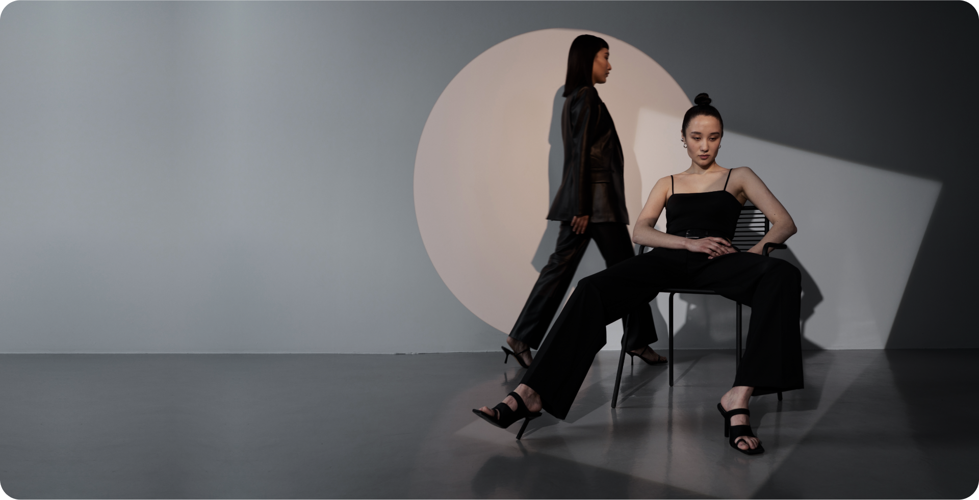 Behind project banner showing a person holding a mobile phone with a screen of the app